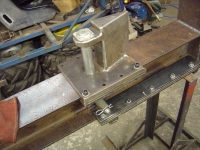  locking pin passes right through beam and two tubes and retained with an R clip